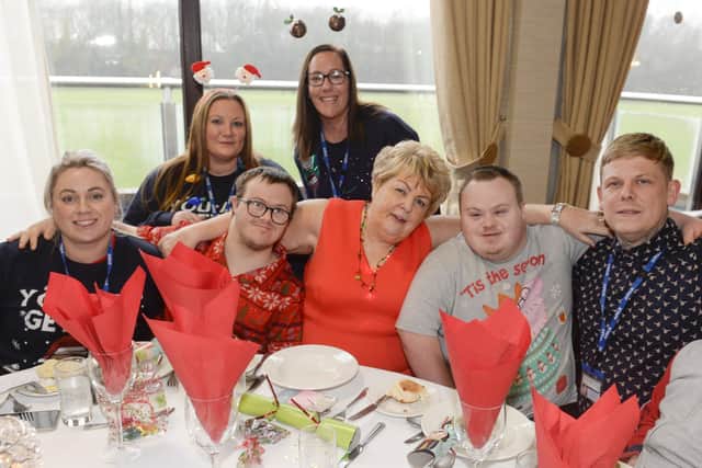 Gloria Stewart with some of the people at a previous Home Alone Christmas Party at Niagara Centre in Sheffield.