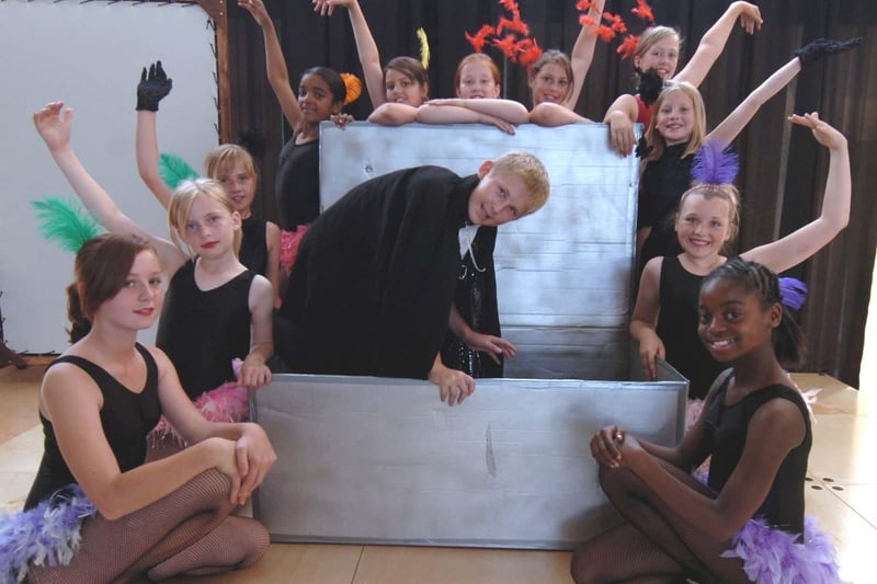 Coit Primary School pupil  Chris Haines (Harry Houdini) prepares to escape from the box, pictured with the 'Showgirls' in the school s production about the escape artist. Houdini in 2008