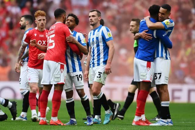 Max Lowe of Nottingham Forest and Duane Holmes of Huddersfield embrace at Wembley Stadium: Mike Hewitt/Getty Images