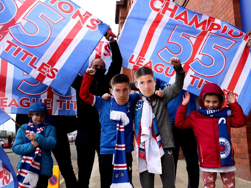 Rangers fans celebrate outside the Ibrox Stadium after Rangers win the Scottish Premiership title.