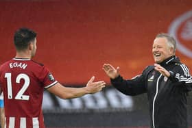 All smiles for John Egan from Chris Wilder after his defender scored a late winner for Sheffield United against Wolves last night (Photo by PETER POWELL/POOL/AFP via Getty Images)