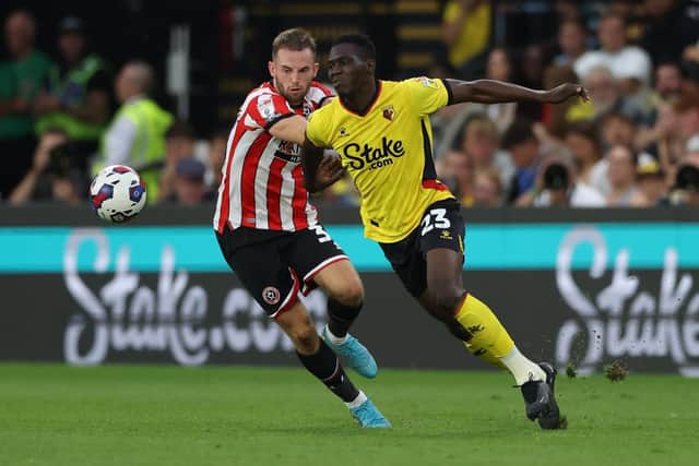 Ismaila Sarr of Watford and Rhys Norrington Davies of Sheffield United: Jonathan Moscrop / Sportimage