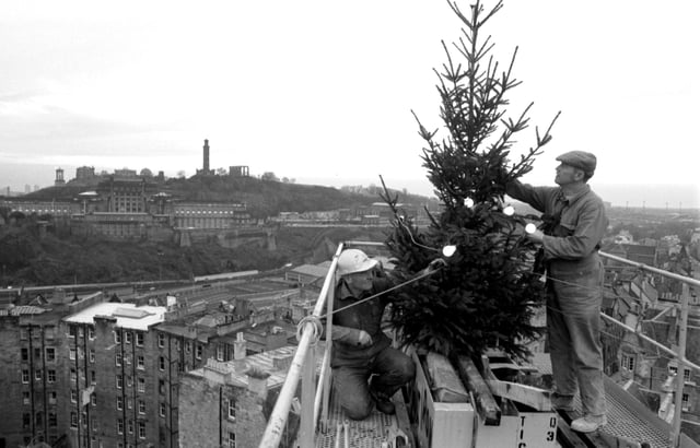 Men from construction company Laing's, working at the High Steet in Edinburgh, decorated their crane with a Christmas tree in December 1985.