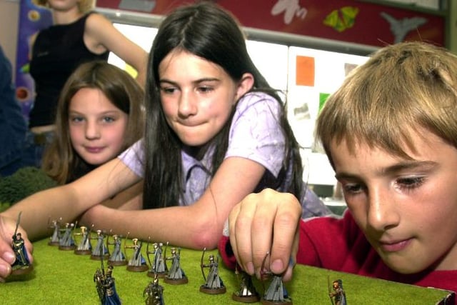 Sara Brautigam, Alison Macguire, Jerry Macguire playing a fantasy war game in Central Doncaster Library, 2002.