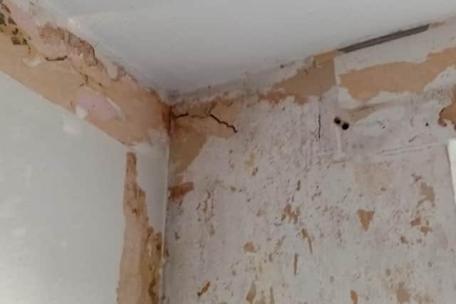 The couple claim plaster has been falling off the wall in 'huge chunks' since the moved in over 4 months ago.