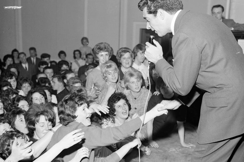 Singer Frankie Vaughan received a warm welcome from the ladies when he performed at Leith Town Hall in aid of Boys Club in 1961. The woman holding his hand is Irene Smith.