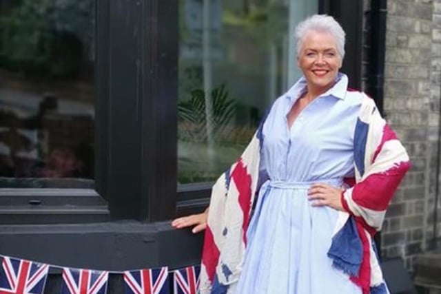 Georgia Johnson poses with her Union Jack flags.