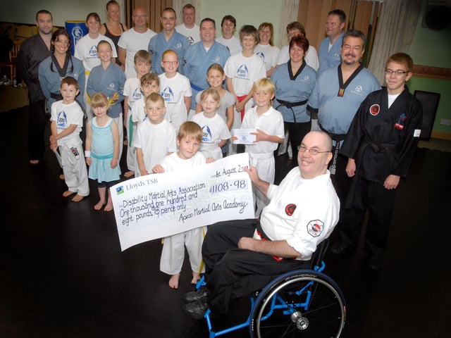 In 2009  Apex Martial Arts group presented £1108 to David Lee of the Disability Martial Arts Association pic shows Lewis Walvin handing over the cheque and other members of the group