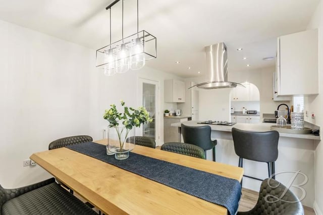 This is the dining area within the open-plan kitchen. A pleasant spot to enjoy a family meal.