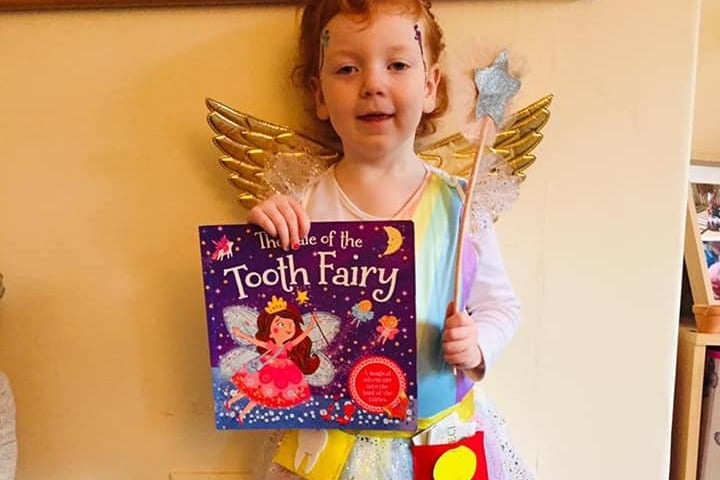 Emma Hole, age 4, dressed as the Rainbow Toothfairy complete with pennies and teeth.
