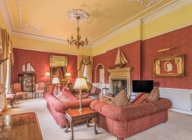 The splendid dining room is to the right with a carved oak book case, thought to date back to King William lV, and is complemented by the intricate cornicing and deep set sash windows overlooking the lawn. The drawing room to the left also has beautiful painted cornicing and painted wall features, along with an open fireplace with original tiles. Most of the windows benefit from original shutters and stunning oak floors.
