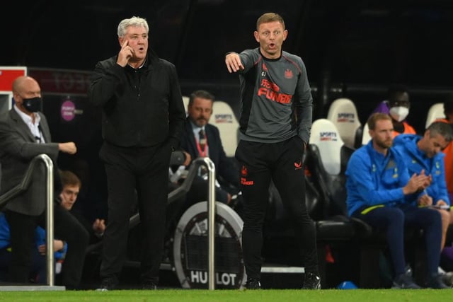 Newcastle manager Steve Bruce (l) with coach Graeme Jones on the touchline during the Premier League match between Newcastle United and Tottenham Hotspur at St. James Park on October 17, 2021 in Newcastle upon Tyne, England.