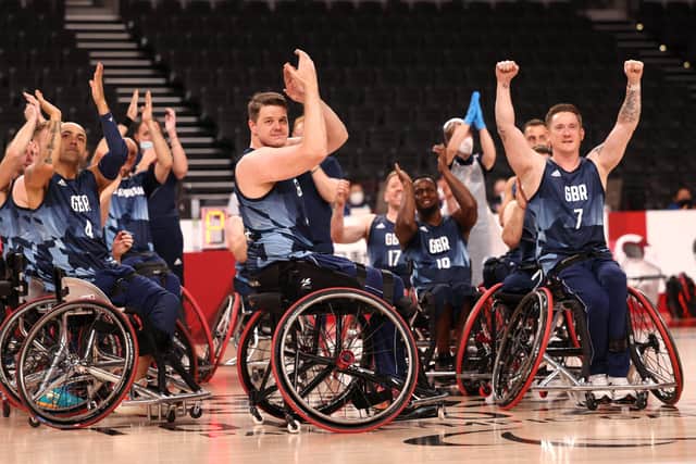 Team Great Britain celebrates after defeating Team Spain during the men's Wheelchair Basketball bronze medal game.