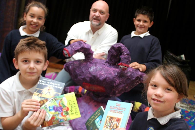 Pupils at Spire Junior School in Chesterfield  meet author Simon Rose in 2006. Callum Weldon, Christie-Ann Scott-Briggs, Richard Miller and Casey Fawcett are pictured with a model of an alien that they made.