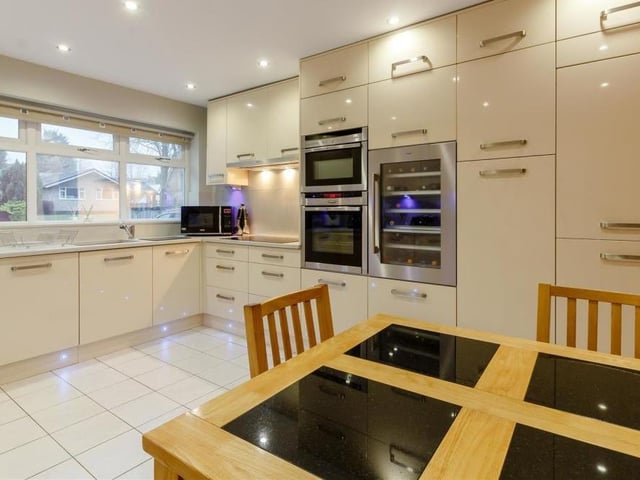 The kitchen features a range of high-specification, integrated, stainless steel appliances, including an AEG wine cooler and washing machine, Neff double electric oven and separate combination microwave with hide and slide door. Don't forget either the integrated dishwasher and fridge freezer.
