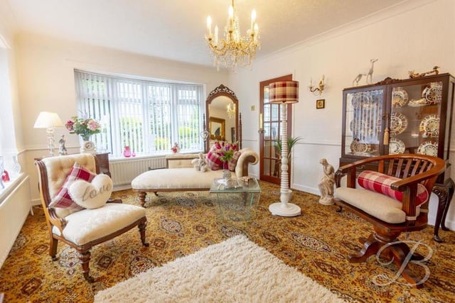 The living room can only be described as beautiful. It boasts a carpeted floor, feature fireplace, central-heating radiator and bay window to the front of the property, with a second window to the side.