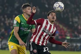 Sheffield, England, 14th September 2021. Morgan Gibbs-White of Sheffield Utd and Jordan Storey of Preston North End during the Sky Bet Championship match at Bramall Lane, Sheffield. Picture credit should read: Simon Bellis / Sportimage
