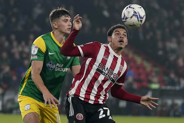 Sheffield, England, 14th September 2021. Morgan Gibbs-White of Sheffield Utd and Jordan Storey of Preston North End during the Sky Bet Championship match at Bramall Lane, Sheffield. Picture credit should read: Simon Bellis / Sportimage
