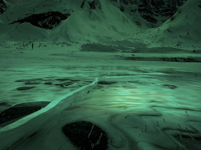 Observing the location, seasons, and angles for about three years, I researched the perfect shoot that I had in my mind. I fell in love with this composition in Northern Canada.
Northern lights in Yukon, Canada. The day I took this photo, the weather was extremely difficult; the temperature was 20 degrees below zero and the strong wind didn’t make the situation any easier. I had a certain vision of the photo I wanted, and because of the extreme weather, I had to build the photo in stages. Taking many shots in different stages of the Aroura rising gave me a good chance to get the final photo here.