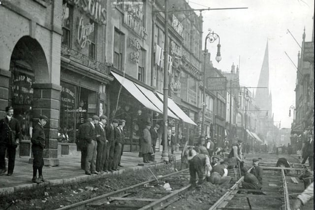 This great image shows work to lay tram tracks along the high street in Chesterfield town centre, with tha famous Crooked Spire in the background.