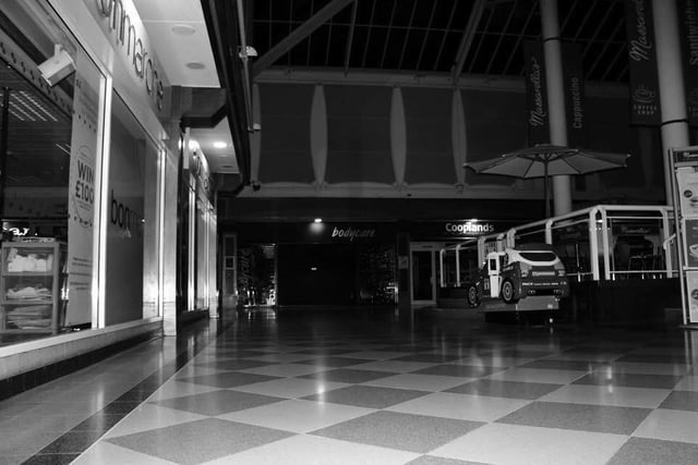 The ghostly black and white image of a haunted precinct at Sutton? Ghost buster Lee Roberts, from Sutton, was at the Idlewells Shopping Centre during an investigation in 2015. It was the venue for the world's first Facebook LIVE ghost hunt, Lee says. It is also where a mysterious lady is said to roam the building. Legend has it that she apparently used to collect the dead from the old streets that stood there long before the shopping centre was built.