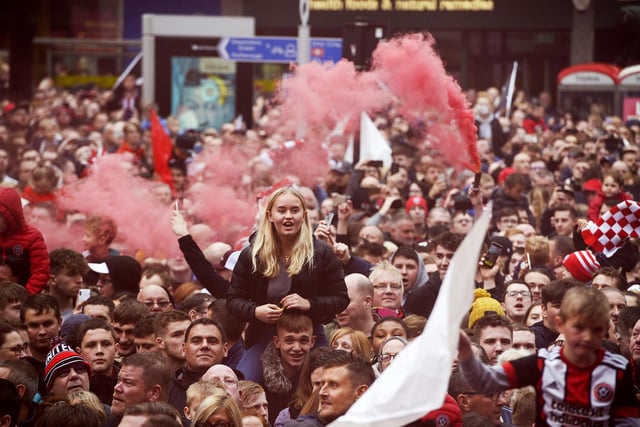Sheffield United fans celebrate their promotion to the Premier League at Sheffield Town Hall, May 7, 2019