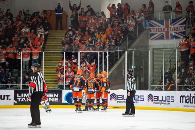 Steelers celebrate in the first period with their fans.