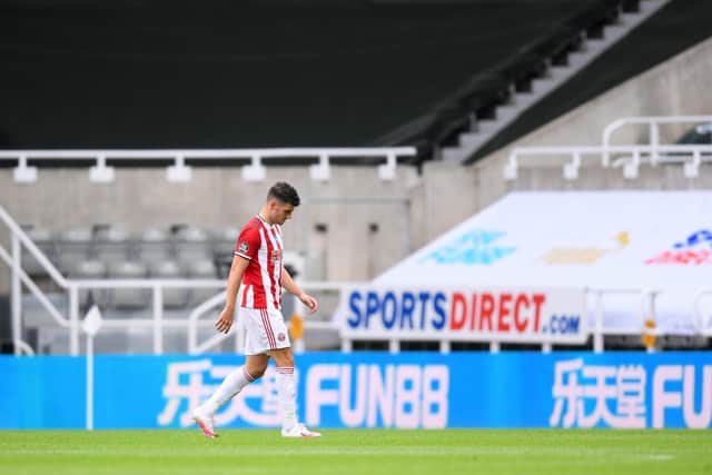 Sheffield United's John Egan walks off after being shown a red card during the 3-0 defeat against Newcastle United at St James' Park this afternoon. (Photo by Laurence Griffiths/Getty Images)