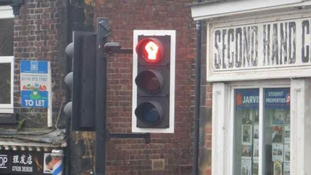 A traffic light on Crookesmoor Road has been changed to show a black power salute.