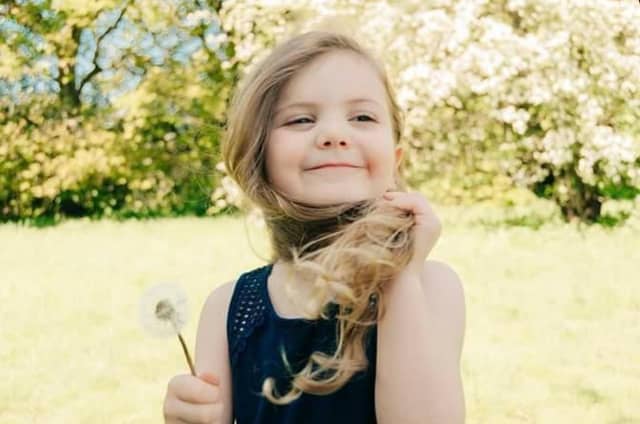 Child with dandelion by @believeinmagicimages