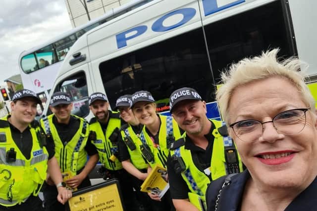 Eddie Izzard poses for a photo with police officers in Sheffield city centre, where they were taking part in Project Servator, which is designed to disrupt criminals planning terrorist acts and other offences