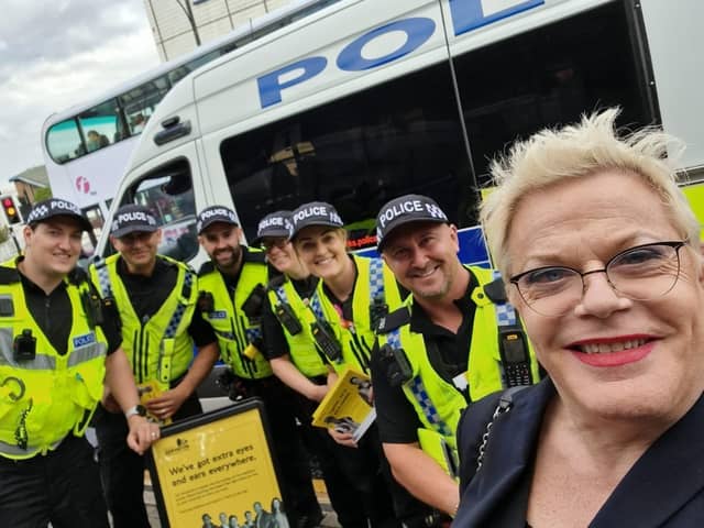 Eddie Izzard poses for a photo with police officers in Sheffield city centre, where they were taking part in Project Servator, which is designed to disrupt criminals planning terrorist acts and other offences