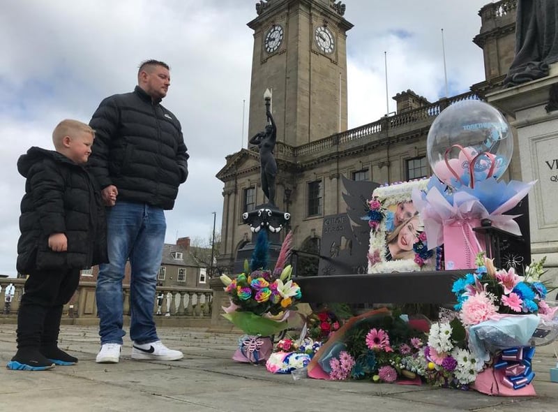 Christopher Robertson and his five year old son Bobby in reflective mood on Pink and Blue Day at South Shields Town Hall.
