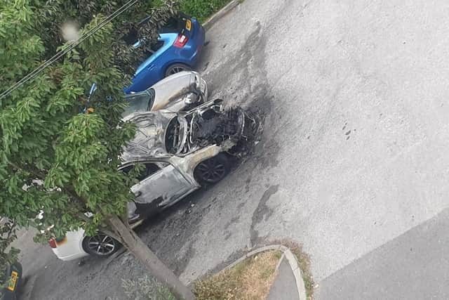 Shocked residents told how they heard a car ‘explode’ after a suspected arson attack in a car park in Meersbrook, Sheffield. Picture shows the aftermath this morning. Police are appealing for information