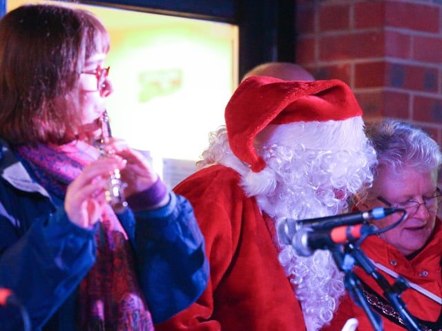 Father Christmas joins in the carols. Emsworth Christmas lights switch on, St Peter's Square, Emsworth
Picture: Chris Moorhouse (jpns 031221-49)