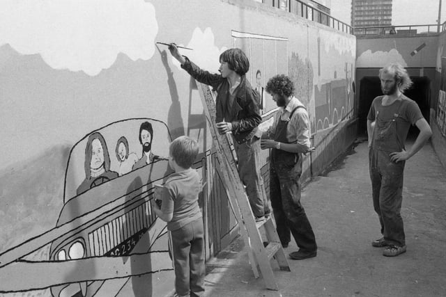 Artists Andrew Carter (extreme right) and Martin Weston (second from right) received help from youngsters on holiday as they transformed a Sunderland subway into an outside art gallery in August 1979.