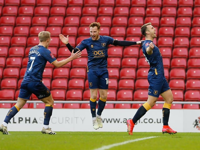 The team celebrate Rhys Oates's early opener.