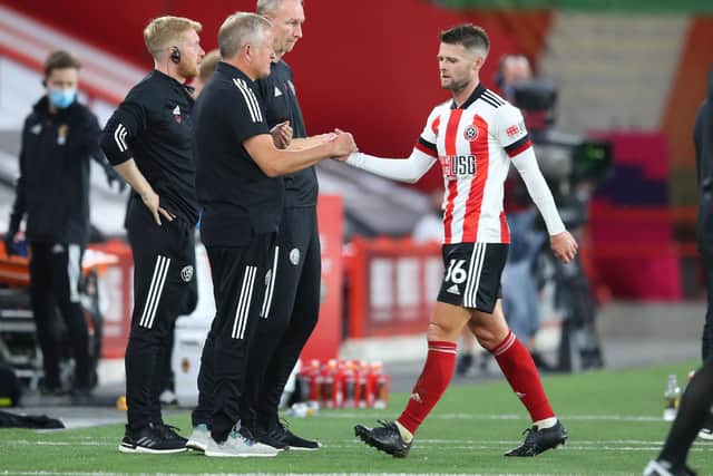 Oliver Norwood shakes hands with Sheffield United manager Chris Wilder after being withdrawn: Simon Bellis/Sportimage