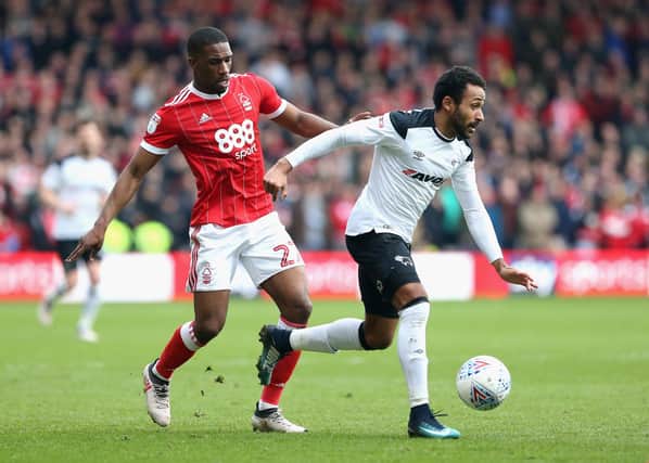 NOTTINGHAM, ENGLAND - MARCH 11:  Tendayi Darikwa of Nottingham Forest and Ikechi Anya of Derby County in action during the Sky Bet Championship match between Nottingham Forest and Derby County at City Ground on March 11, 2018 in Nottingham, England.  (Photo by Alex Pantling/Getty Images)