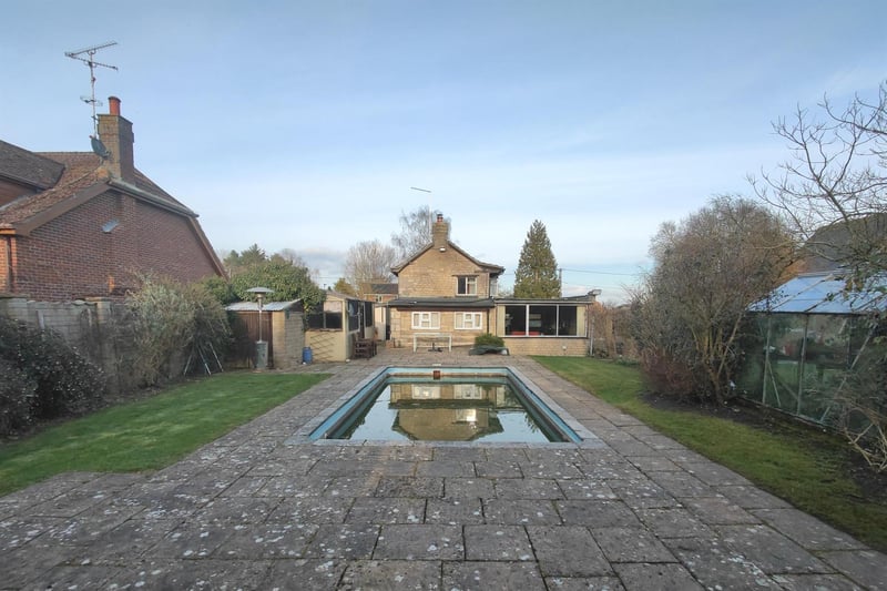 The property features its own outdoor swimming pool