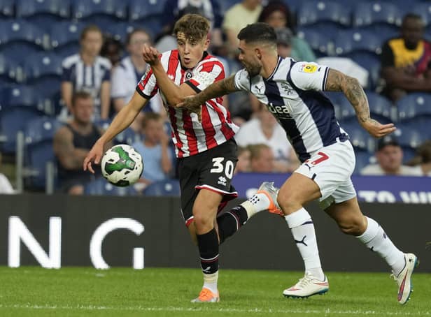 Oliver Arblaster of Sheffield United tussles with Alex Mowatt of West Bromwich Albion on his Blades debut: Andrew Yates / Sportimage
