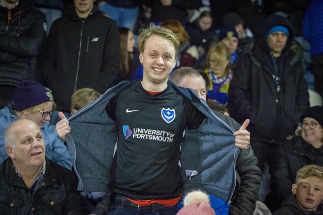 Pompey supporter shows off his replica shirt at Fratton Park.
