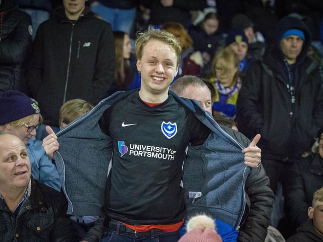 Pompey supporter shows off his replica shirt at Fratton Park.