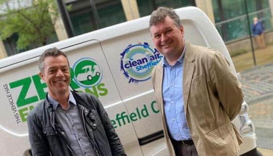 Councillors Robert Johnson (left) and Mark Jones in front of an electric vehicle festooned with Clean Air Sheffeld branding