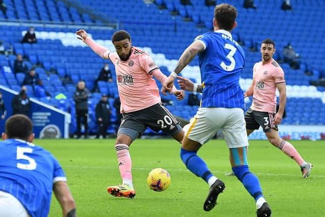 Jayden Bogle scores on his debut during Sheffield United's 1-1 draw at Brighton & Hove Albion yesterday.  (Photo by GLYN KIRK/POOL/AFP via Getty Images)