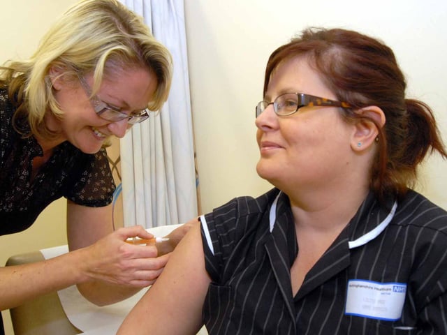 Louise Page Ward Manager at the Ashfield Health Village got her Swine Flu vaccine in 2009. Pictured with Rebecca Garner Senior Nurse
