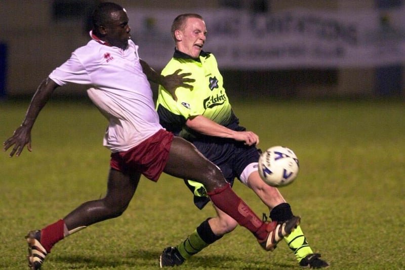 Paul Lovering takes on Mickey Trotman in Hibs' match with the President's XI in Trinidad