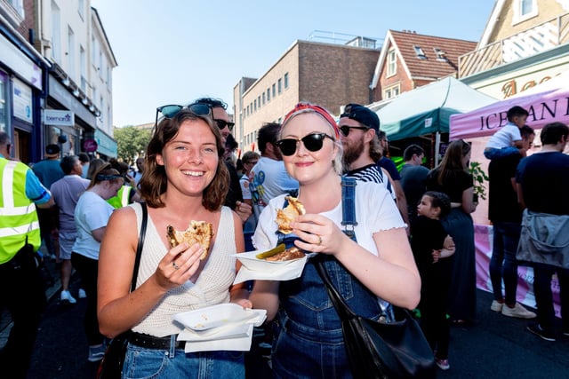 Southsea Food Festival 2019 at Palmerston Road, Southsea - Rachel Tatton and Ciara Emery enjoy their French Connection cheese toasties. Picture: Vernon Nash 200719-011