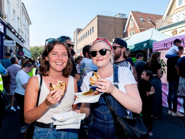 Southsea Food Festival 2019 at Palmerston Road, Southsea - Rachel Tatton and Ciara Emery enjoy their French Connection cheese toasties. Picture: Vernon Nash 200719-011