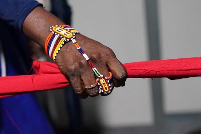 A close-up of a person's hand as they take part in a protest